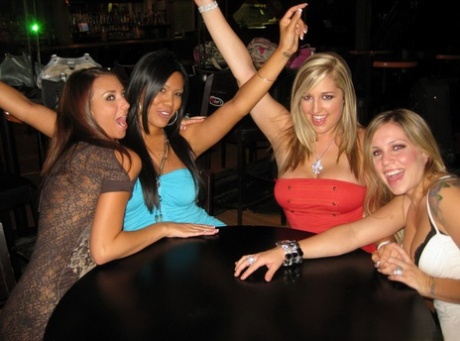 Party girls break out the whipped cream during a reverse gangbang in club
