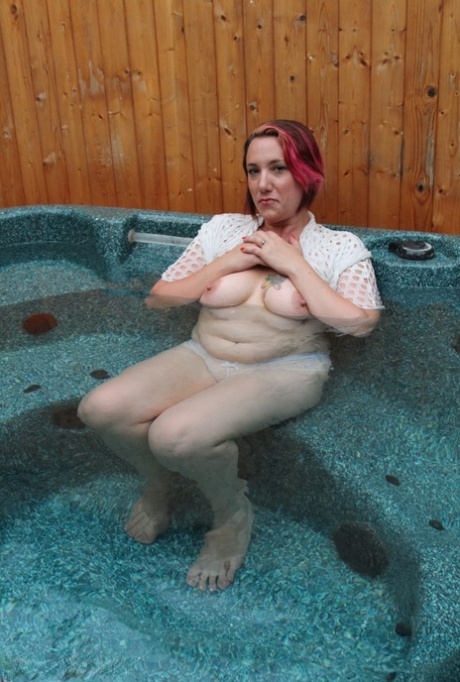 During a dip in an outdoor hot tub, a pluck amateur removes a mesh top.