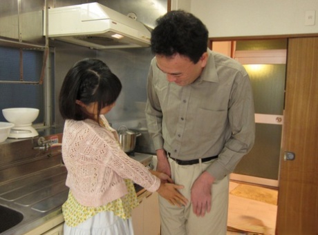 Japanese chick Tomoyo Isumi seduces her man friend in the kitchen