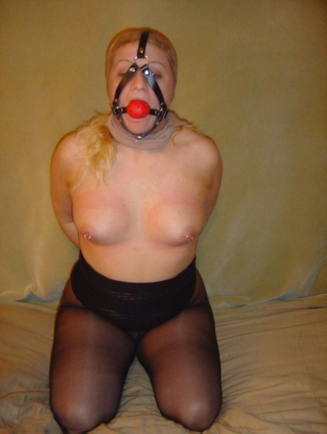 Chubby blonde slave has her ball gag removed before giving a POV blowjob