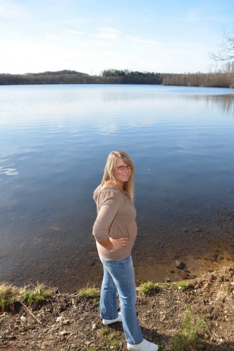 As she gets naked by a river, overweight sweet susi dons glasses.