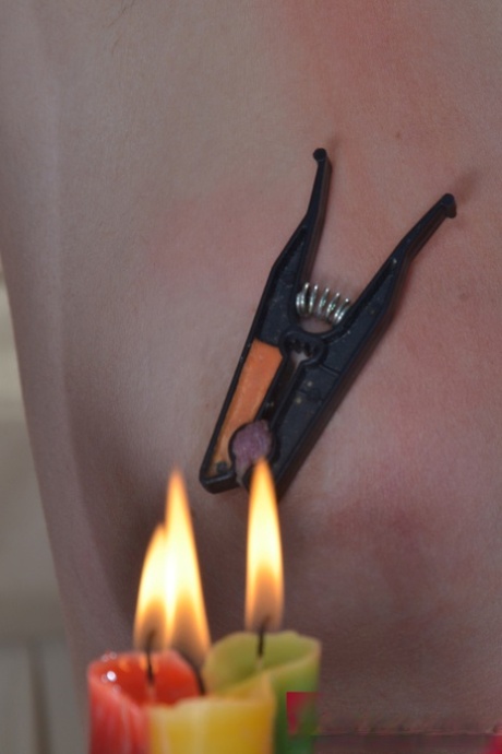 Hot candle wax is used to torture the naked slave before sexual intercourse, along with a cumshot shot in the mouth.