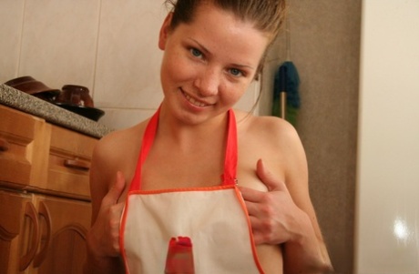 Charming Teen Kimmy Takes Off A Kitchen Apron While Going Nude At Home