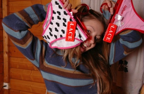 Stunty girl exhibits her charming panties while going shirtless.