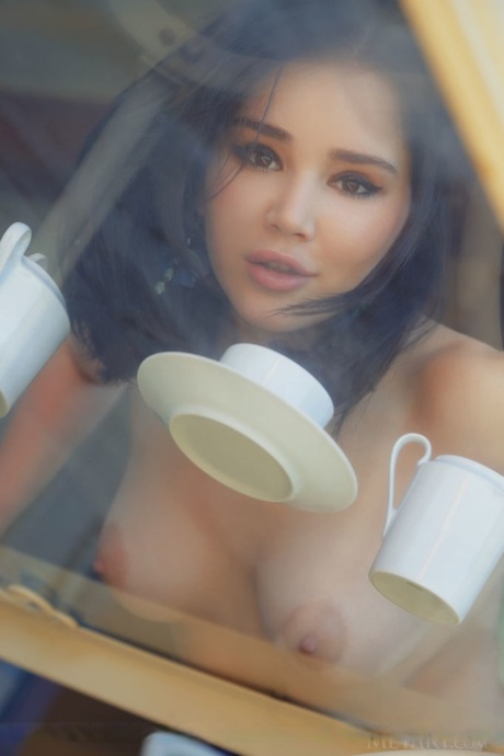 Gorgeous teen Malena gets totally naked while taking tea on a patio