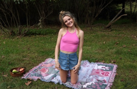 Amateur teen Addee Kate does a handstand before toying her pussy in the yard