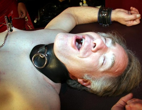 A white woman screams at a man who is restrained during CBT.