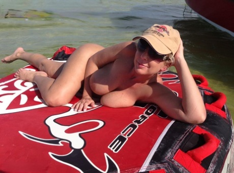 Big Titted Amateur Lounges On An Air Mattress While Naked In A Ball Cap