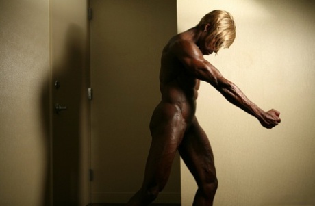 Ebony Bodybuilder Sports Blonde Hair While Showing Her Ripped Physique
