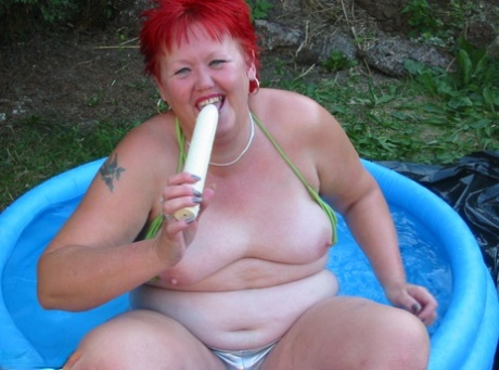 A wading pool and a dildo await the older redheaded BBW Valgasmic Exposed.