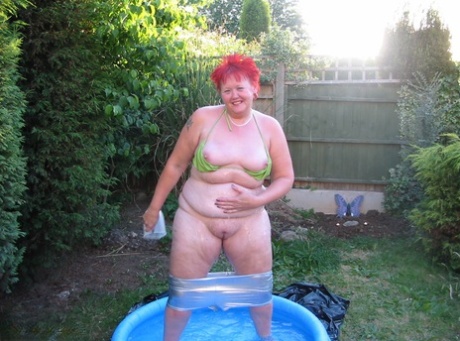 In a swimming pool with his dildo, the older redheaded individual named BBW Valgasmic Exposed enjoys playing in the water.