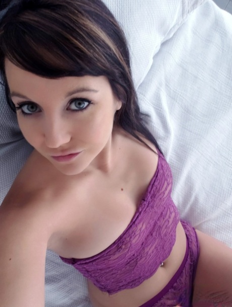 Young Amateur Andi Land Takes Self Shots Of Her Firm Breasts On Her Bed