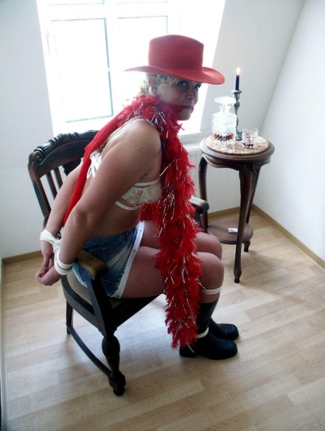 Before getting a chair, the blonde girl is tied up and given her cleaved gait.