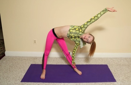Adorable teen Kristy May pleasures her pussy after a yoga routine