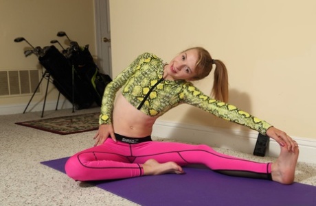 Adorable teen Kristy May pleasures her pussy after a yoga routine