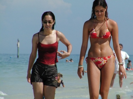 Hidden: Young girls are filmed naked in their bikinis as they swim into the ocean.