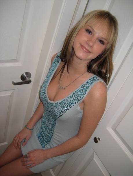 The dirty blonde amateur releases her breasts from a dress and proceeds to grab them.