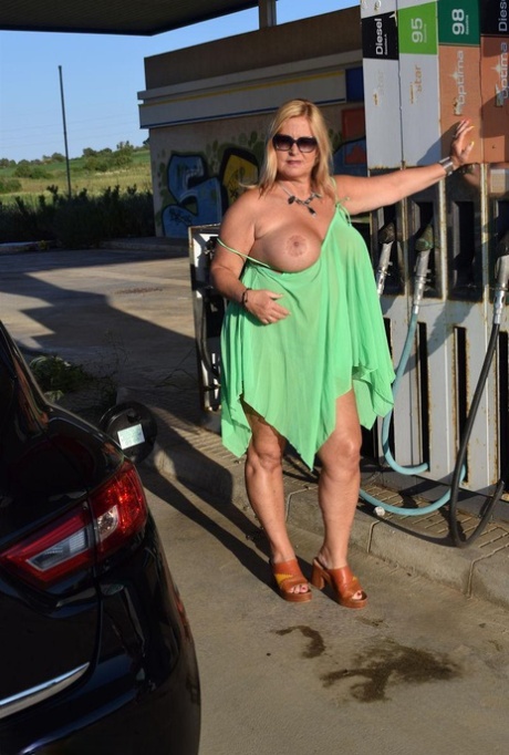 The nude amateur singer Chrissy exposes her chest and buttocks at a gas station.