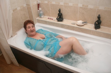 Redhead nan Kinky Carol shows her big ass and snatch in a bathtub #15