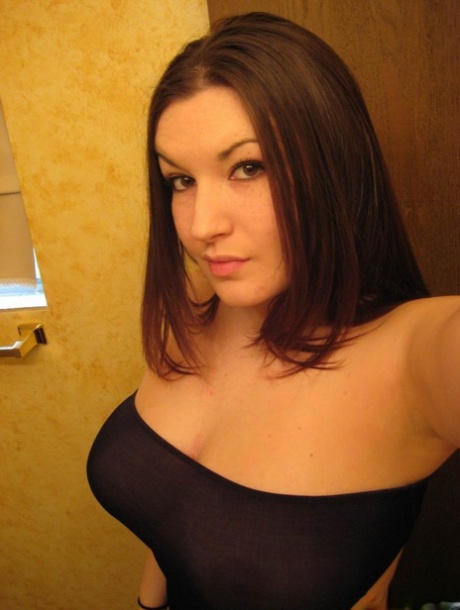 Amateur Solo Girl Takes Self Shots In A Mirror Of Her Large Boobs