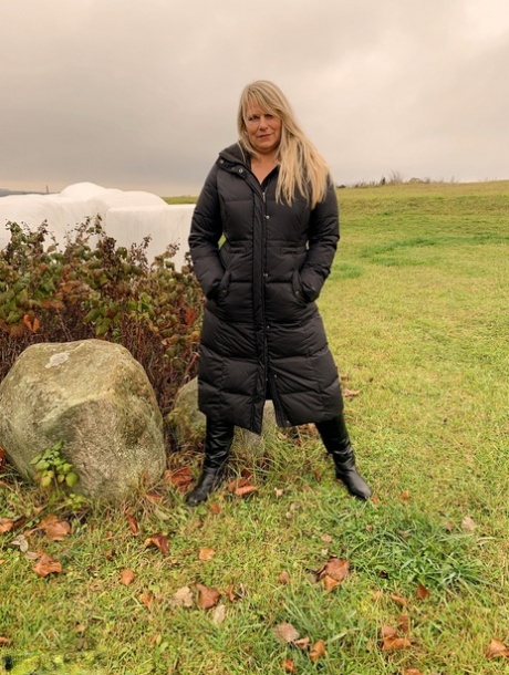 Winter coat: Old blonde Sweet Susi expose herself in a field wearing her winter coat, left.