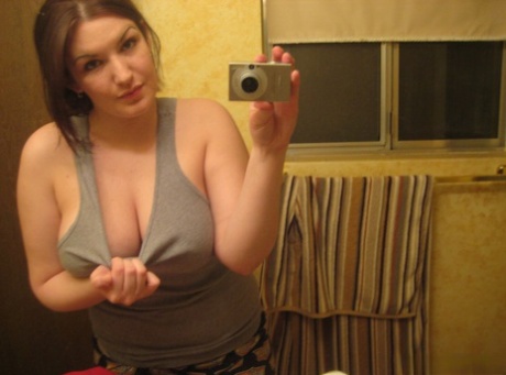 Amateur Solo Girl Takes Mirror Selfies Of Her Large Breasts