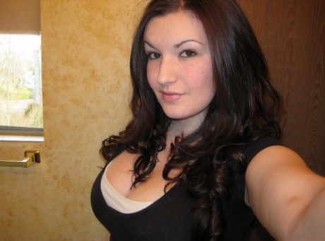 A curvy brunette amateur performs self-shot action in a bathroom while looking for a killer.