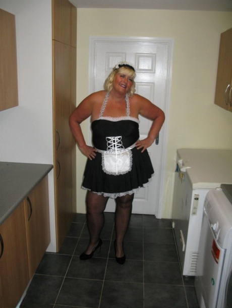 In a kitchen while working, blonde maid Chrissy Uk exposes herself.