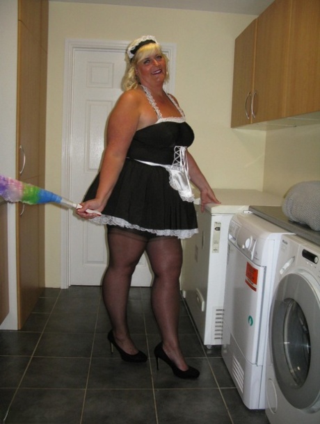 During her work in a kitchen, Chrissy Uk expose herself as an overweight blonde maid.
