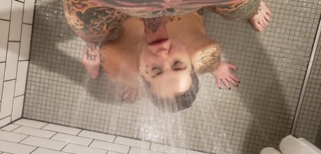 Heidi Van, a girl with tattoos on her body, experiences a mouth wound after anal abduction in a shower.