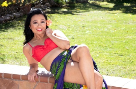 Middle-aged Asian Woman Lucky Starr Gets Naked On A Backyard Patio