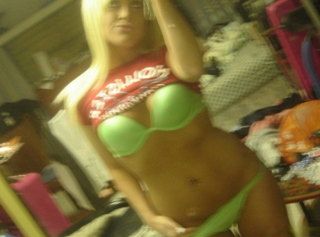 Blonde Teen Takes Selfies While Stripping To A Bra And Thong