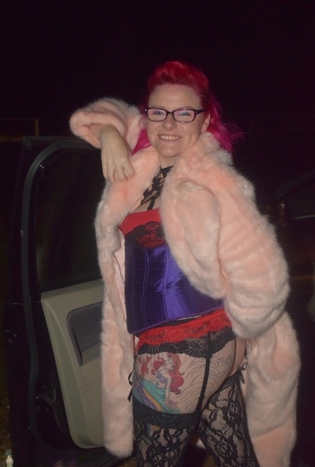 Amateur chick with dyed hair steps out of a vehicle to flash in lingerie