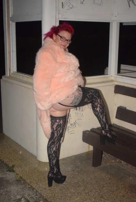 Amateur chick with dyed hair steps out of a vehicle to flash in lingerie