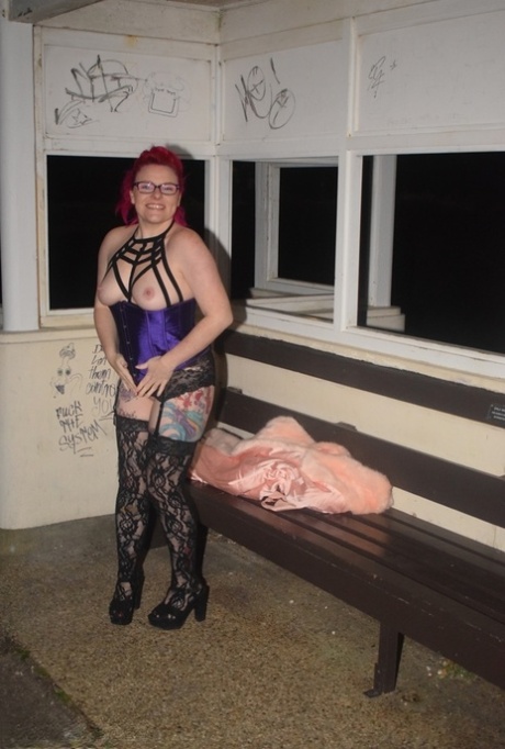 Amateur chick with dyed hair steps out of a vehicle to flash in lingerie