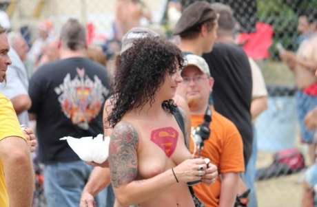 Amateur females display their tits and pussies at an optional clothing event.