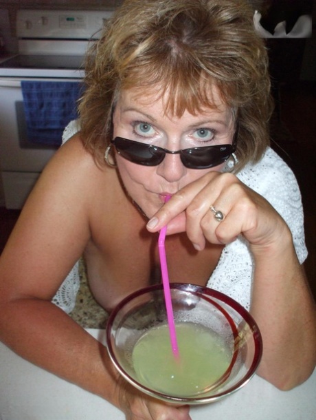 Young age: Breasts show off as Busty Blisses (pictured) drinks her drink before going to rehab.