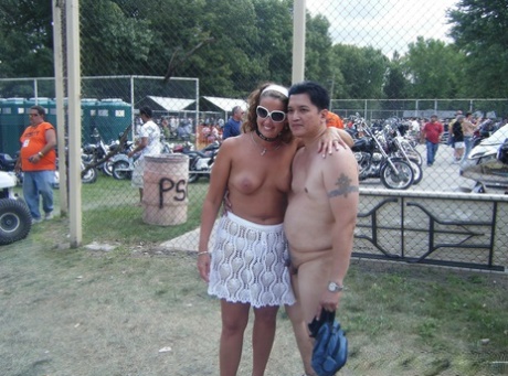 At a clothing optional party, amateur women are allowed to dress in the nude and wear only the upper body.