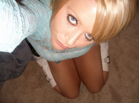 Blonde amateur: Blonde amateur in a sheer top, takes teasing selfies with himself.