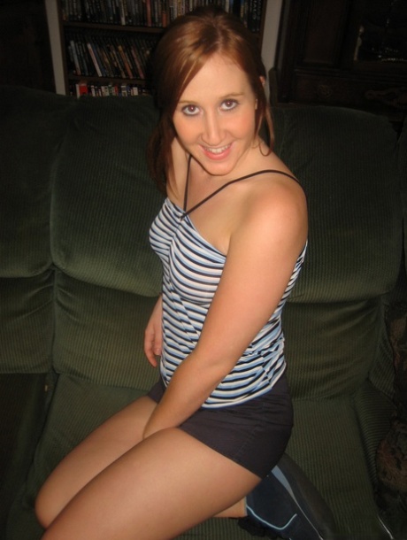Young Redhead Gets Naked On A Sofa While Wearing Running Shoes