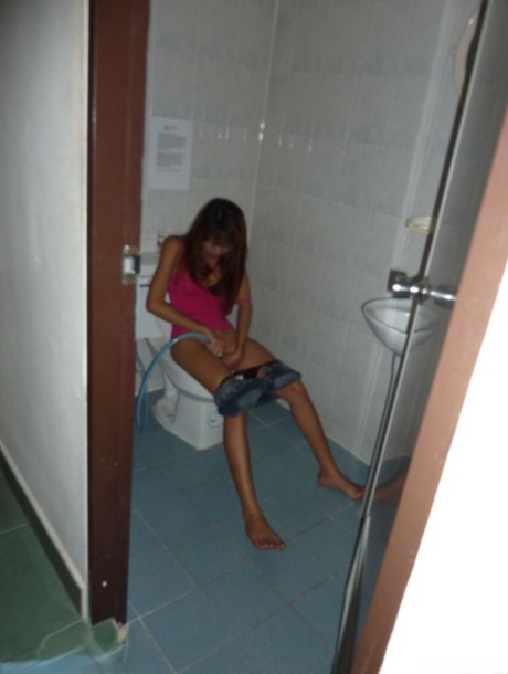 Sexy Thai bar girl parts her moist pussy before fucking a sex tourist