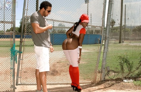 Kali Dreams, an ebony beauty, releases her large booties from her baseball attire.