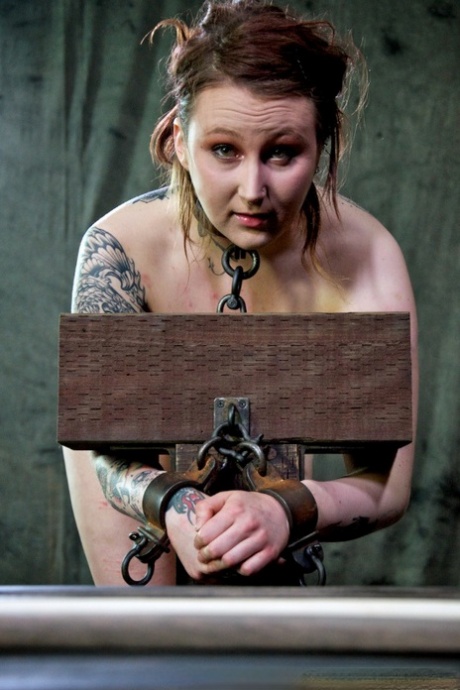 A dungeon crawl features tattooed Mollie Rose, who has visible welt marks on her bare flesh.