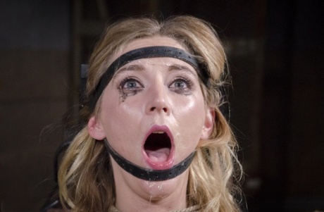 Restrained female Mona Wales is face fucked while impaled on a Sybian