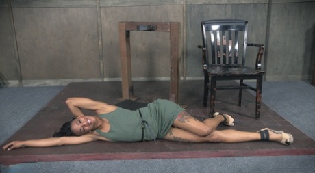 Nikki Darling, the Ebony girl, is held in a neck restraint while being subjected to hard core mouth fuck.