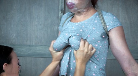 Tortured and fucked by another woman, the girl who has been restrained and gagged is on the spot.