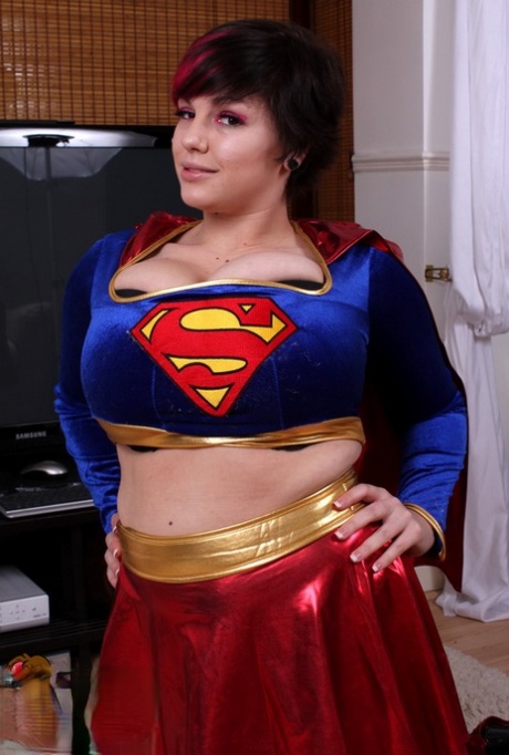 Super tits behind her super hero outfit: Cosplay girl Dors Feline shows off the costumes.