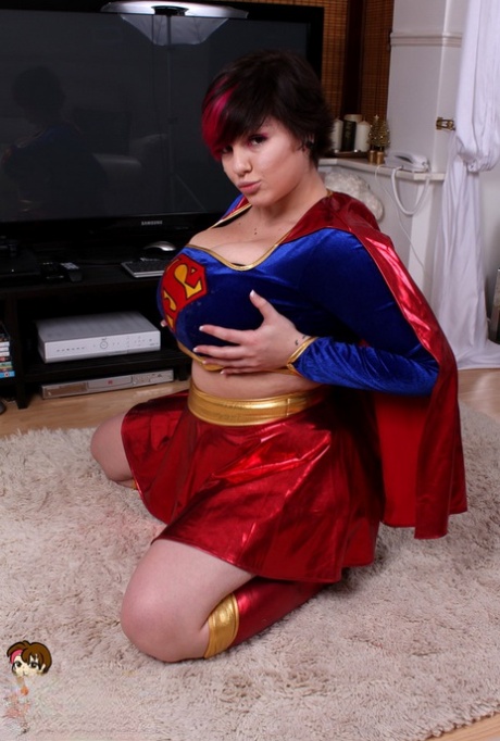 Cosplay girl Dors Feline exposes the super tits that are hidden behind her super hero outfit.
