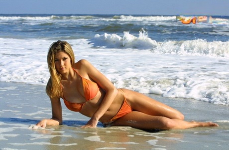 Solo Model Lindsay Schoneweis Lets The Ocean Surf Wash Over Bikini Clad Body