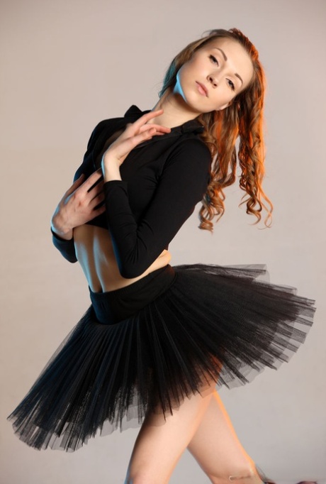 Annett A, a ballerina, exposes her balding pussy in points by wearing a tutu and contorting.